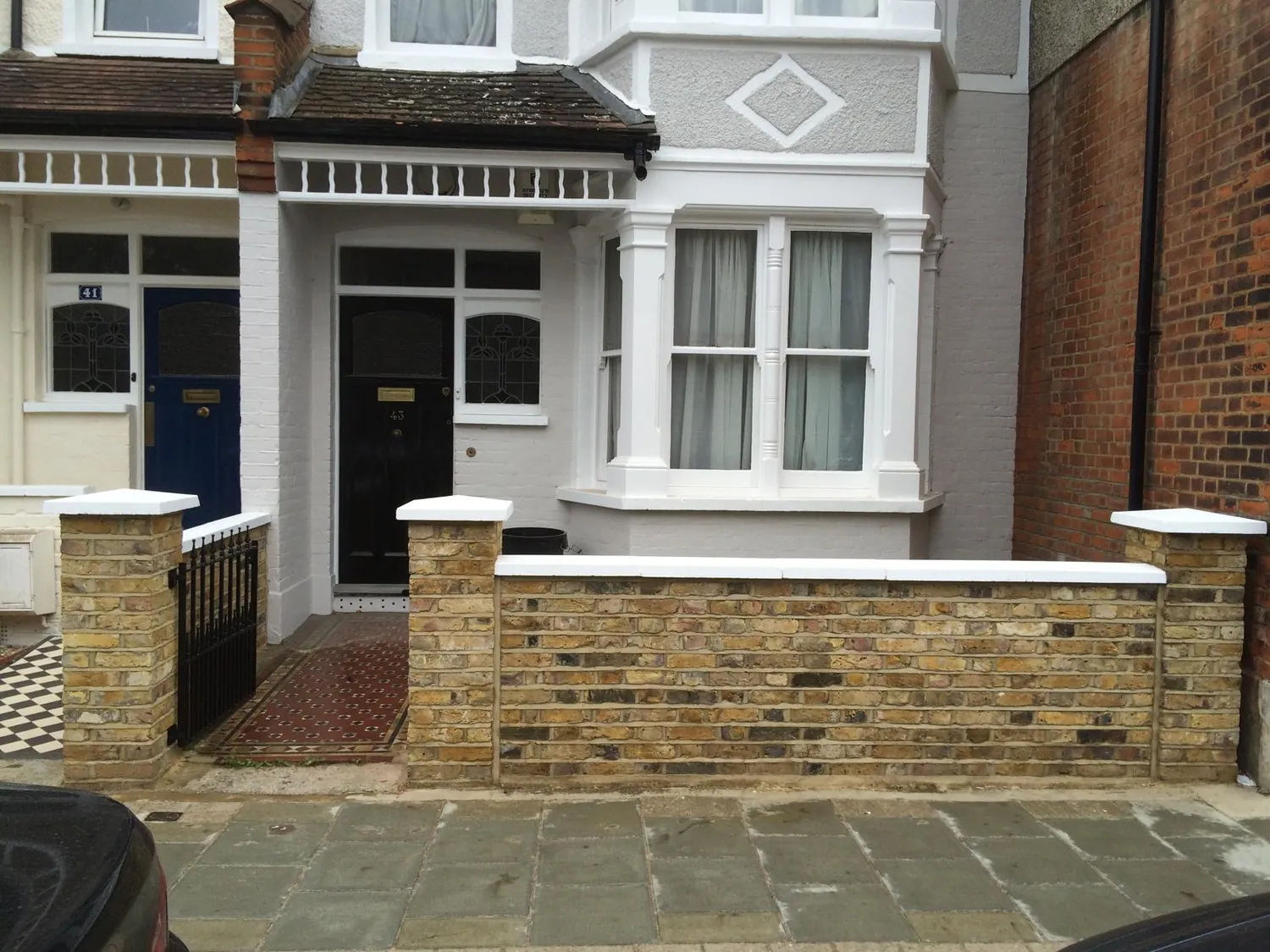 Completed brick boundary wall by Johnson Construction