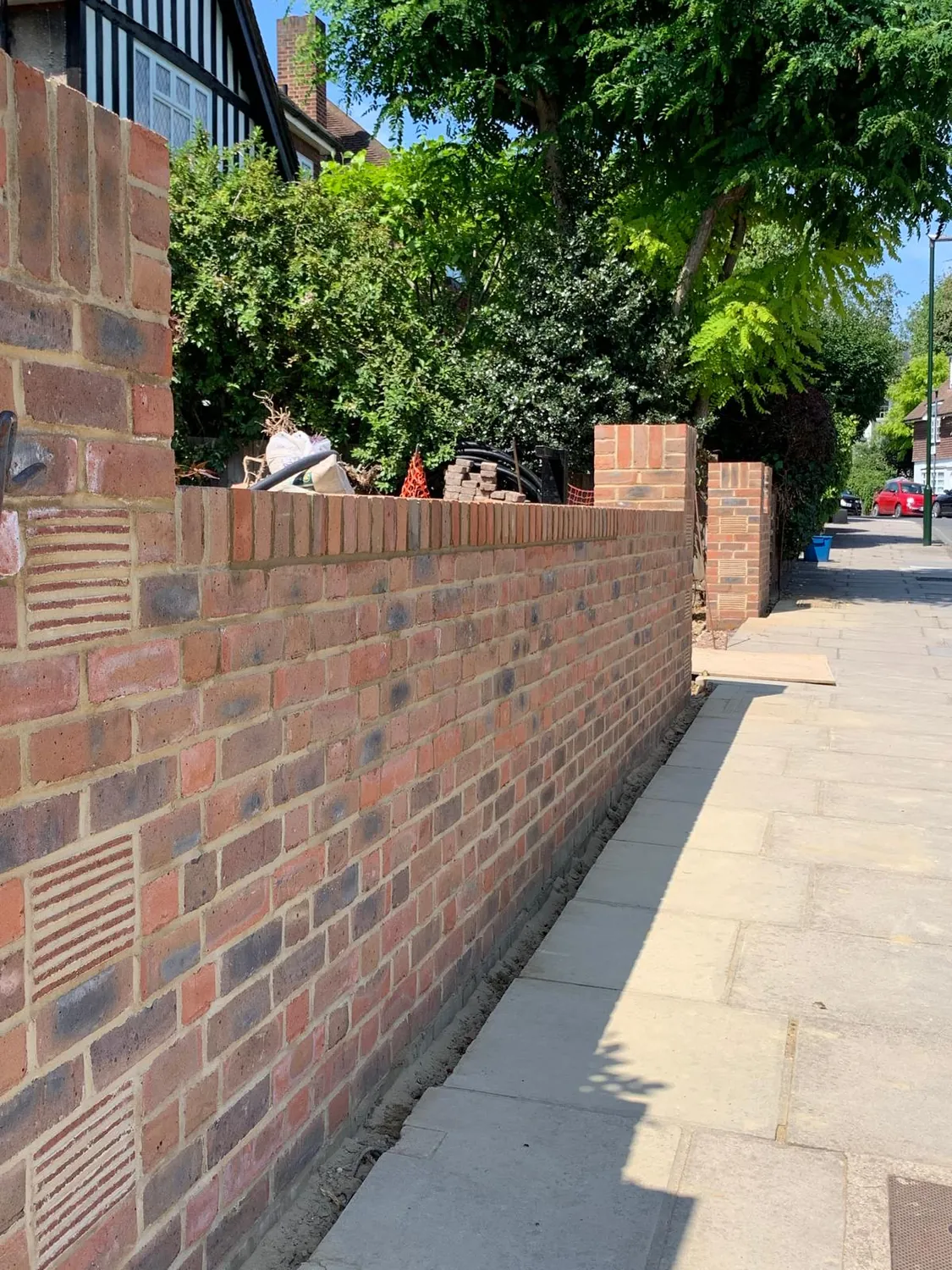 Long brick boundary wall by Johnson Construction