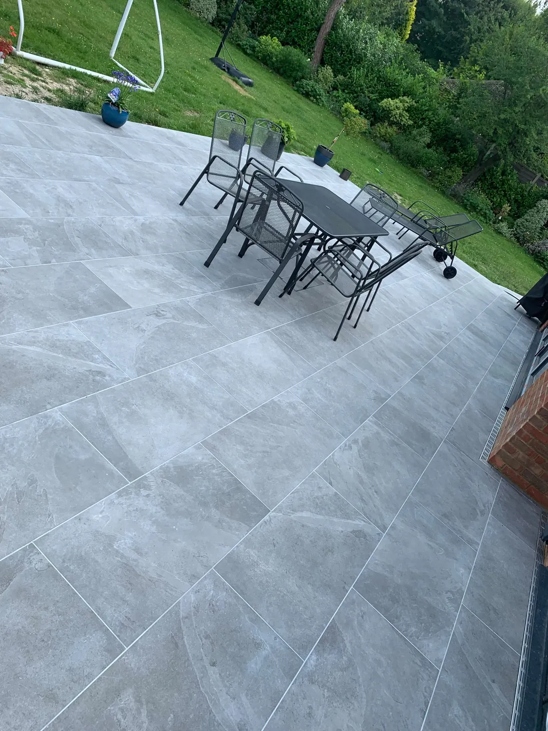 Completed grey garden patio by Johnson Construction